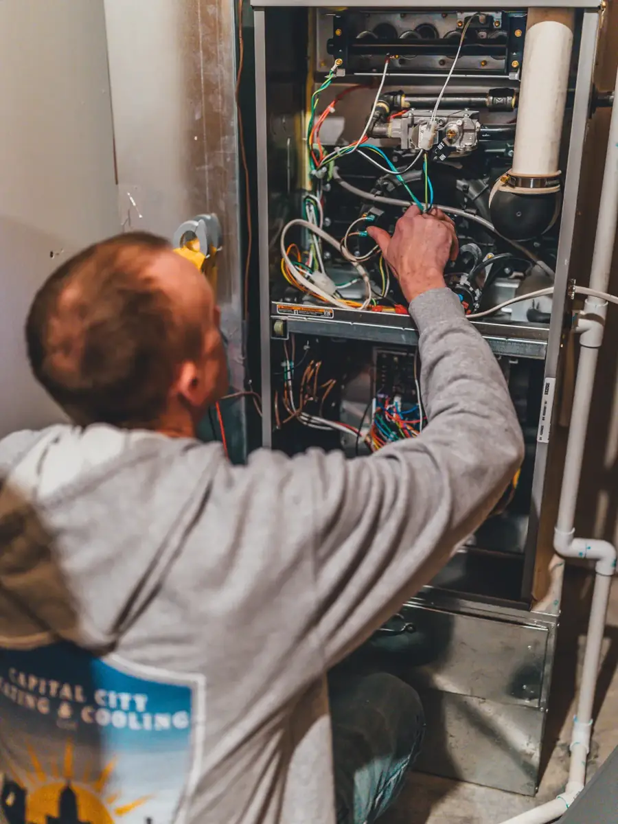 Technician working on an air handler